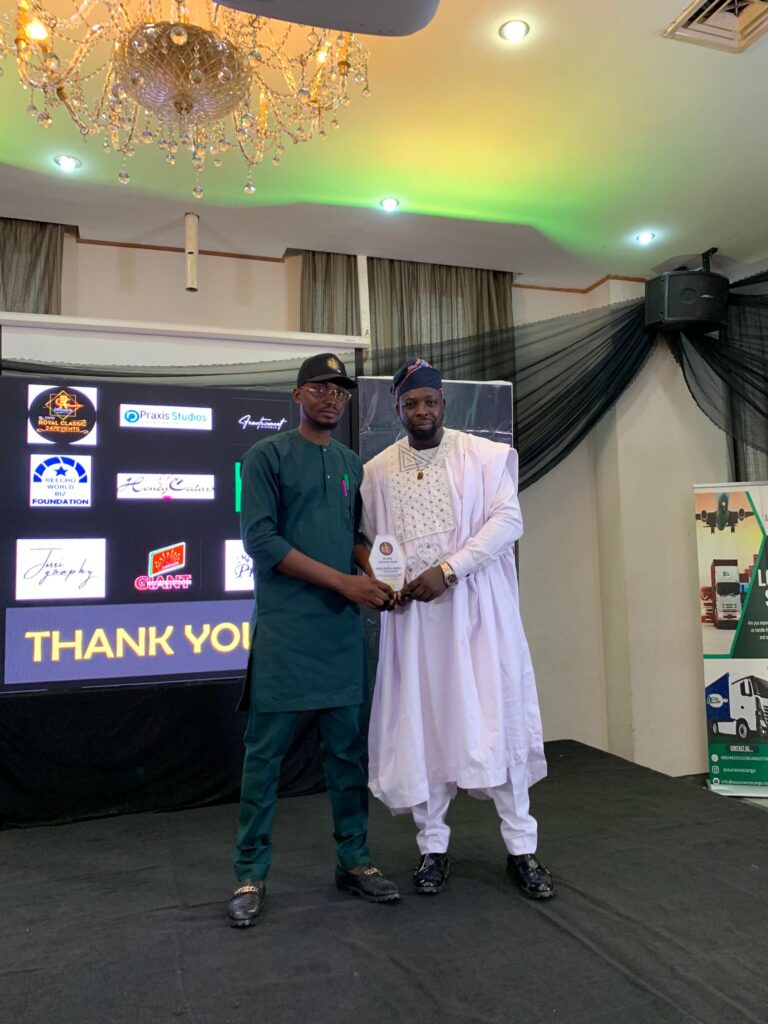 Edens digital Founder receiving the award for top web development agency in Lagos on behalf of company